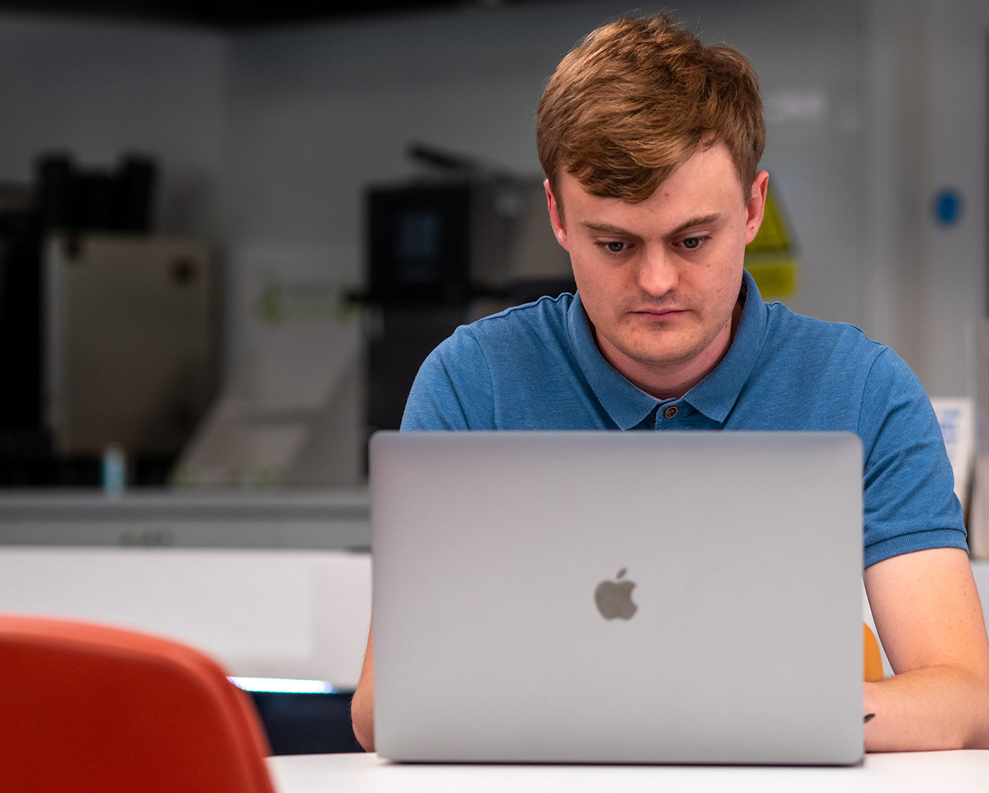 Software engineer Daniel Pomfret working on a laptop