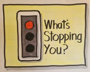Illustration of a red traffic light and the words 'what's stopping you?'